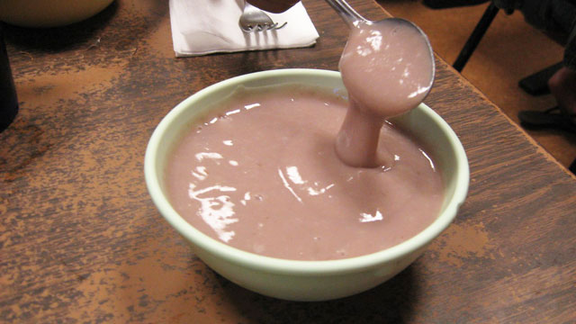 Poi in a bowl with spoon