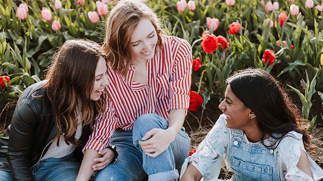 Three girls talking