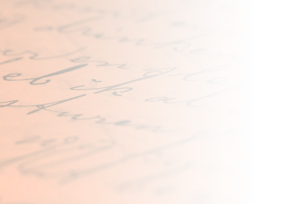 A close-up photograph of cursive handwriting. No legible text. 