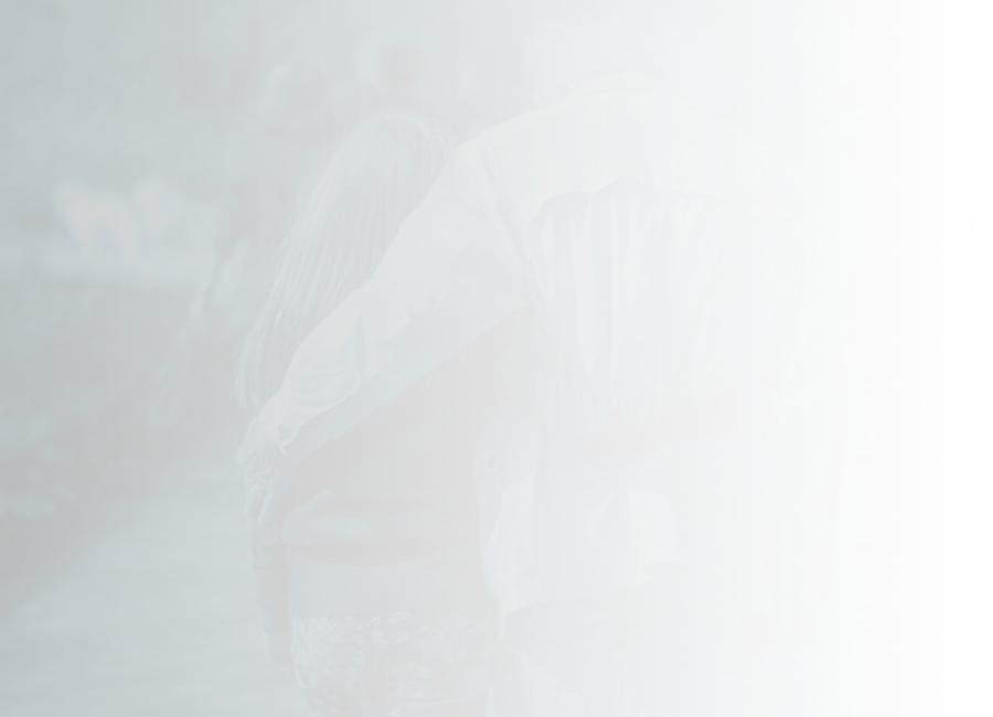 Grandparent and grandchild walking with an arm around each other