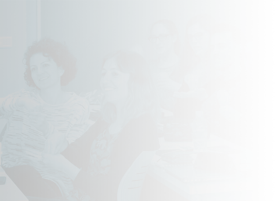 A group of students sitting at desks and signing in unison