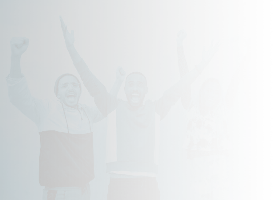 A group of four people with their arms raised in celebration