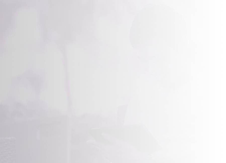 A man smiling while using a smart device