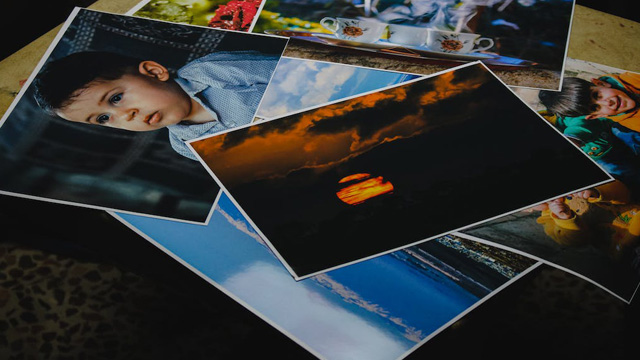 Photographs spread out on a table