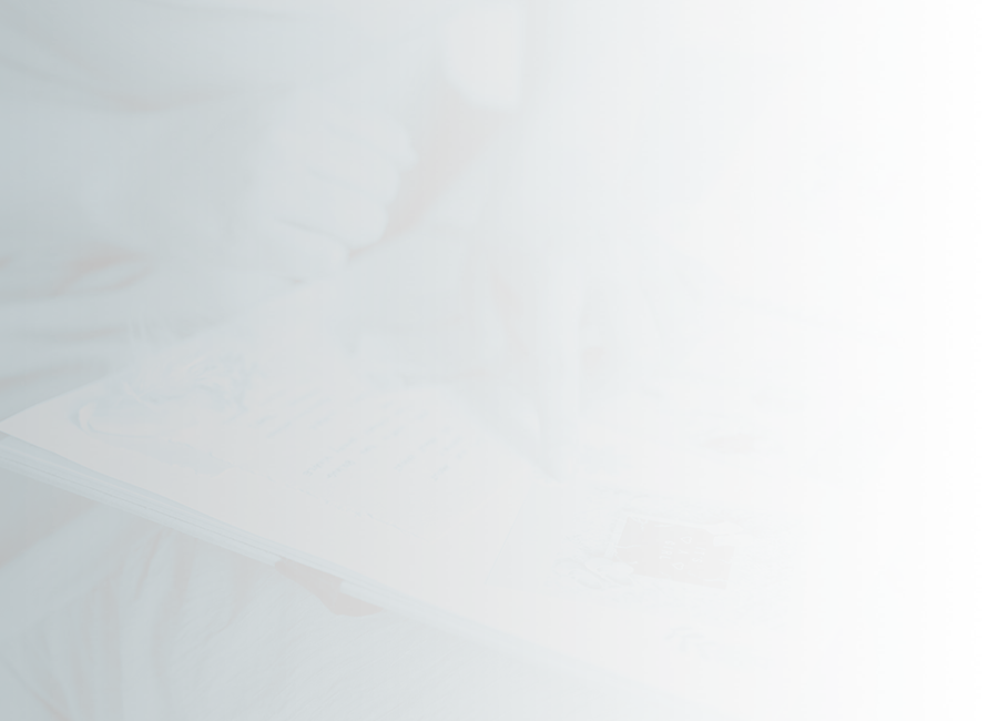 person pointing at picture in scrapbook