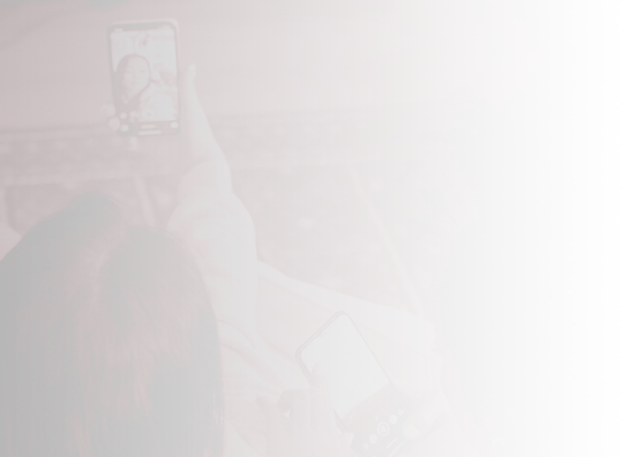 Two young people using mobile phones