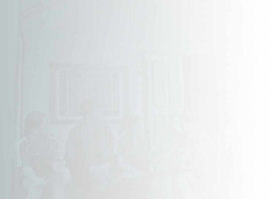 people sitting outside marae