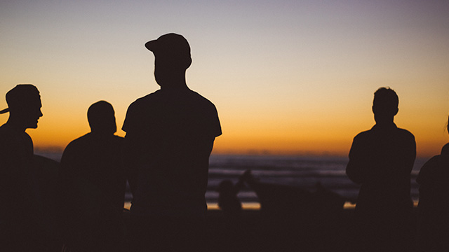 silhouette of four people