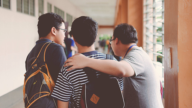 group of three people at school
