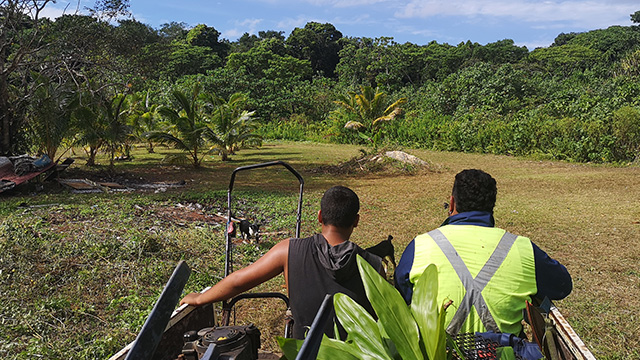 two people sitting in the back of a vehicle