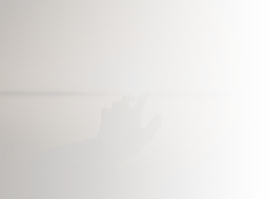 hand reaching out to sunrise