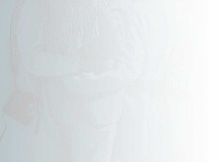 Four people with their arms around each other