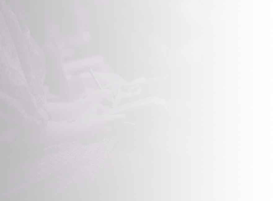 Seated people taking notes